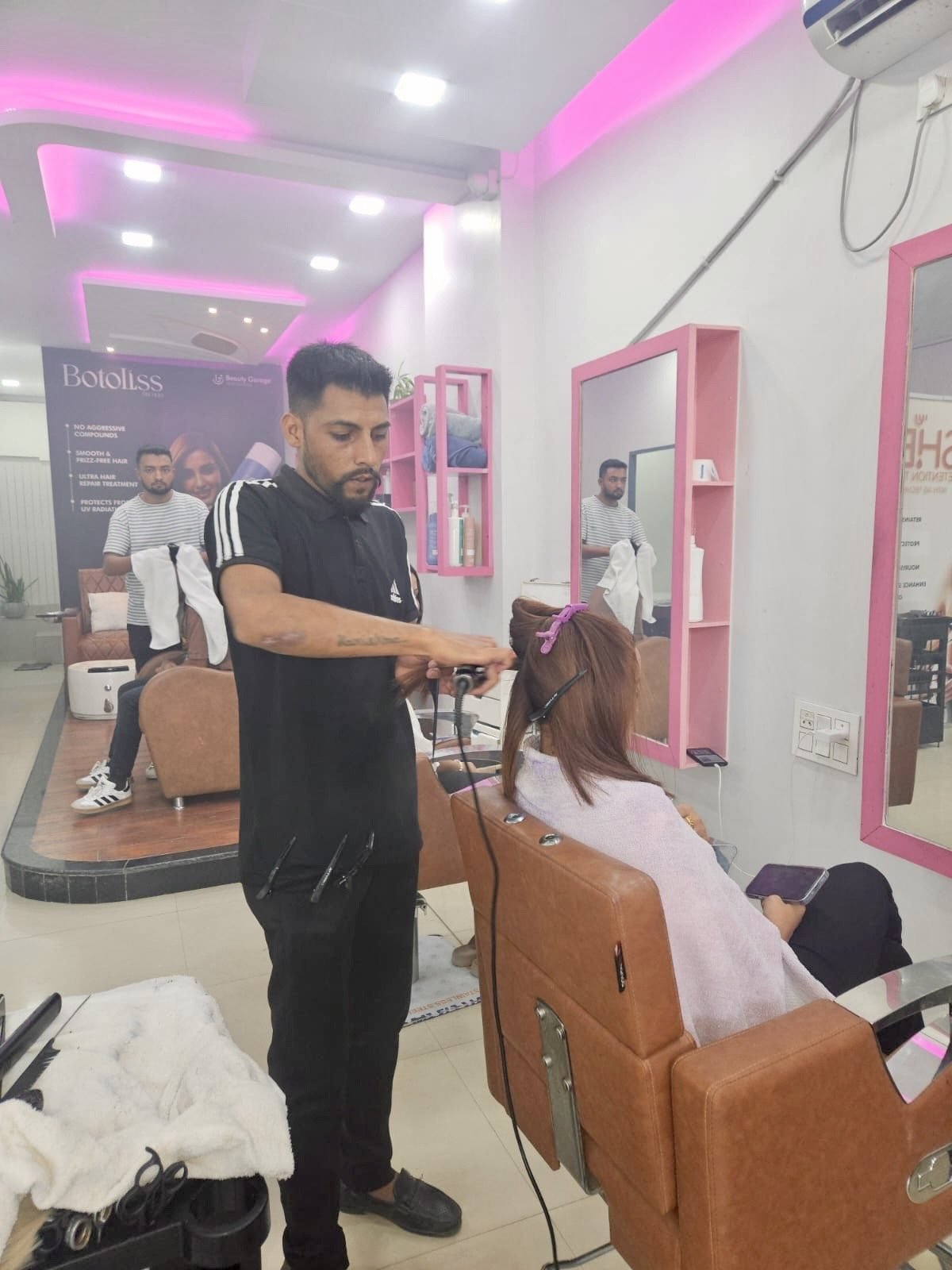 Barber styling a client at Crystal Scissori